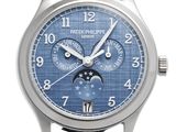 a close up of a wrist watch with a blue dial
