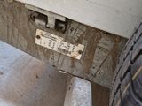 a close up of a car ' s bumper with a tag attached to it