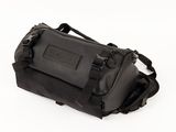the back of a black duffel bag on a white surface