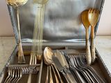 silverware in a silver case with spoons, forks and spoons