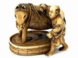 a figurine of a man with a baby on a horse