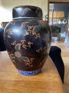 a vase sitting on a table in a living room