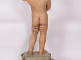 an image of a statue of a child on a pedestal