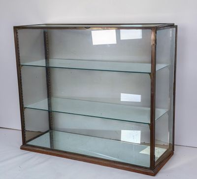 a display case with glass shelves in it on a white surface