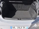 the back of a car with its trunk open on the side of the road