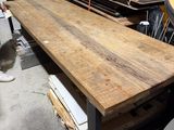 a large wooden table in the middle of a room