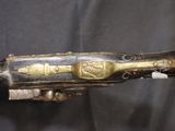 an image of a very old gun that is on display