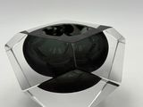 a glass vase with a black glass inside of it