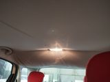 two red seats in the back of a car