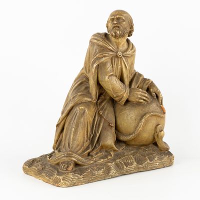 an image of a statue of a man sitting on top of a sheep