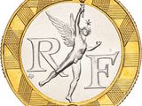 Gros plan sur une pièce d'or ornée d'un ange