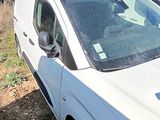 a white van that is parked on the side of the road