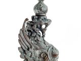 a statue of a lion with a crown on it ' s head