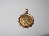 a gold coin with a woman ' s face on it