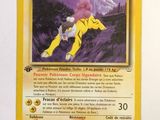 a close up of a pokemon card on a white surface