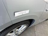 a close up of a car with a sticker on it