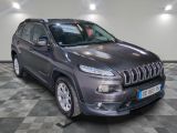the jeep compass is parked in a large room with a checkered floor
