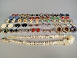 several pieces of jewelry are arranged on a white surface