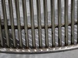 a bird that is sitting inside of a bird cage