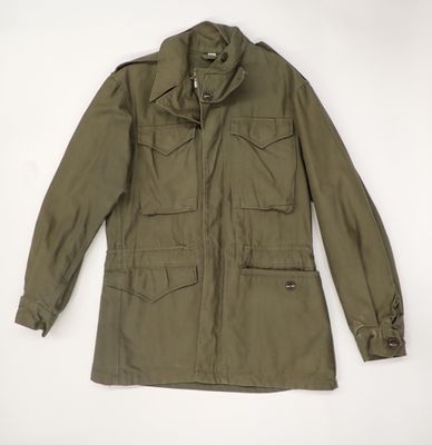 the jacket is green and has buttons on the collar