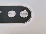 a close up of a button on the back of a cell phone