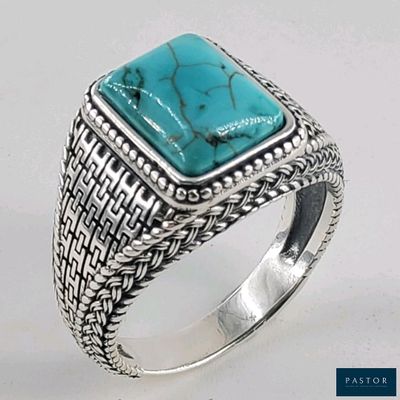 bague en argent massif sertie d'une pierre de turquoise