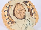 a straw hat with a ribbon around it