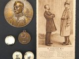 an old picture of a couple of men standing next to a medal