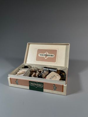 a box with a variety of items in it on a table