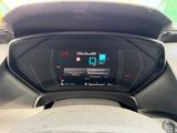 the dashboard of a car with a digital display in the center