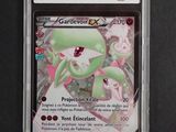 a close up of a pokemon card in a plastic case