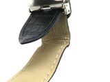 a black strap on a watch with a silver buckle