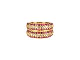 a close up of a gold ring with pink and white stones