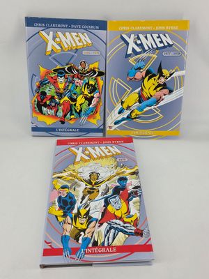 the x - men comic books are sitting on a white surface