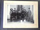 an old photo of a group of people posing for a picture