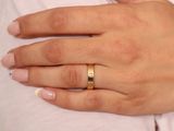 a woman with a ring on her finger and a ring on her hand
