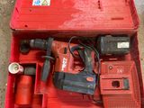 a red tool box with a drill and a hammer in it