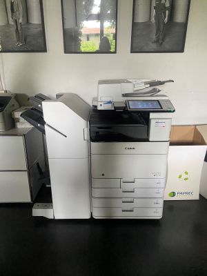 a printer that is sitting on a desk in a room