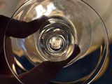 a person holding a wine glass in their hand