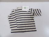 a white and black striped shirt with a tag on it