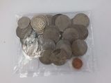 a lot of coins in a bag on the table