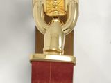 a gold watch on a red leather strap with diamonds on it