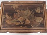 a wooden table with a floral design on it