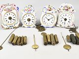 many different clocks and pendulums that are on the table