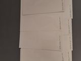three sheets of paper are stacked on top of each other