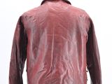 leather jacket on a mannequin stand on a white background