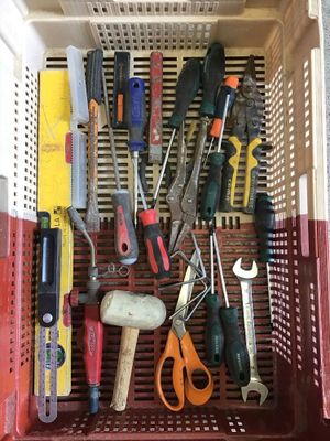 many different tools in a basket on the table