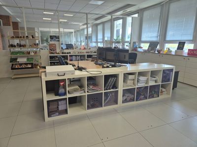 an image of an office with a desk and a computer