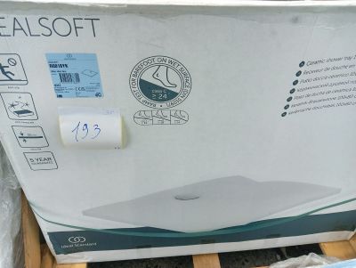 packaging for a new laptop computer sitting on top of a pallet