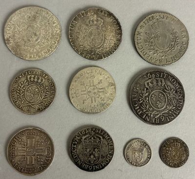 six different types of coins are shown on a white surface